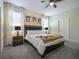 This cozy bedroom features a large window, decorative lamps, and neutral tones at 4532 Target Blvd, Kissimmee, FL 34746