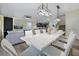 Dining area showing a modern table and a view to the living space at 4532 Target Blvd, Kissimmee, FL 34746