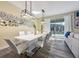 Dining room showcasing a modern table and a view of the pool at 4532 Target Blvd, Kissimmee, FL 34746