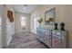 Elegant entryway featuring tiled floors and a mirrored console table at 4532 Target Blvd, Kissimmee, FL 34746