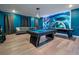 Game room featuring a pool table with Tron-themed wall decor and living room seating at 4532 Target Blvd, Kissimmee, FL 34746