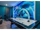 Game room featuring an air hockey table with neon Tron-themed wall decor and bar seating at 4532 Target Blvd, Kissimmee, FL 34746