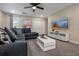 Stylish living room with modern furnishings, a large TV, and ample natural light, perfect for entertaining or relaxing at 4532 Target Blvd, Kissimmee, FL 34746