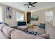 Comfortable living room with plush seating and a sleek entertainment center at 4532 Target Blvd, Kissimmee, FL 34746