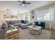 Bright living area with a large sectional sofa and natural light at 4532 Target Blvd, Kissimmee, FL 34746
