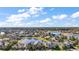 Beautiful aerial shot of a neighborhood complete with manicured lawns, water features, and mature trees at 4770 Cains Wren Trl, Sanford, FL 32771