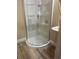 Compact bathroom featuring a corner shower with built-in shelving and modern fixtures at 4770 Cains Wren Trl, Sanford, FL 32771