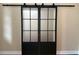 Modern interior sliding doors featuring metal frames and translucent glass at 4770 Cains Wren Trl, Sanford, FL 32771