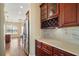 Gourmet kitchen features stainless steel appliances, marble countertops, and wine rack at 4770 Cains Wren Trl, Sanford, FL 32771
