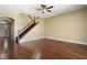 Bright living room featuring hardwood floors, neutral walls, and a staircase leading to the second floor at 4770 Cains Wren Trl, Sanford, FL 32771