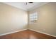 Neutral room features chair rail molding, laminate wood floors, and a window at 4770 Cains Wren Trl, Sanford, FL 32771