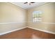 Neutral room features chair rail molding, laminate wood floors, and a window at 4770 Cains Wren Trl, Sanford, FL 32771