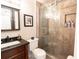 Bathroom with a pedestal sink, toilet and a shower with sliding glass door at 5016 Fawn Ridge Rd, Orlando, FL 32819