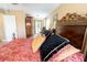 Bedroom featuring a regal upholstered bed and dark wood furnishings at 5016 Fawn Ridge Rd, Orlando, FL 32819