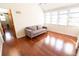 This bonus room provides lots of natural light with lots of windows and wood laminate flooring at 5016 Fawn Ridge Rd, Orlando, FL 32819