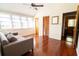 Bonus room with hardwood floors, a sofa, natural light, and access to another room at 5016 Fawn Ridge Rd, Orlando, FL 32819