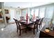 The dining room features a chandelier, large windows and seating for six at 5016 Fawn Ridge Rd, Orlando, FL 32819