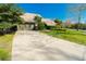 Lovely single-story home featuring an attached two-car garage, attractive landscaping, and a concrete driveway at 5016 Fawn Ridge Rd, Orlando, FL 32819