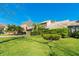 Well-maintained single-Gathering home featuring a lush green lawn, mature trees, and tropical landscaping at 5016 Fawn Ridge Rd, Orlando, FL 32819