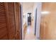View of a hallway leading to a bathroom with nice natural light, vanity, and door to the shower at 5016 Fawn Ridge Rd, Orlando, FL 32819