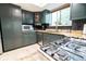 Charming kitchen featuring sleek appliances, granite countertops, and ample storage space at 5016 Fawn Ridge Rd, Orlando, FL 32819