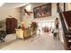 This living room features soaring ceilings and a grand painting that adds an artistic touch at 5016 Fawn Ridge Rd, Orlando, FL 32819