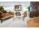 Traditional living room with patterned furniture, area rug, and ornate mirror at 5016 Fawn Ridge Rd, Orlando, FL 32819