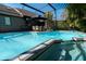 Enjoy this inviting screened-in pool with poolside dining area for outdoor relaxation and entertaining at 5016 Fawn Ridge Rd, Orlando, FL 32819