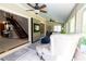 Comfortable sunroom featuring tile floors, backyard views, and neutral decor at 5016 Fawn Ridge Rd, Orlando, FL 32819