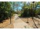 Community walking path featuring pet waste disposal stations and shady trees at 5016 Fawn Ridge Rd, Orlando, FL 32819