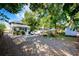 Spacious backyard featuring gravel, parking, storage building and a small patio, ideal for outdoor activities and relaxation at 520 E Anderson St, Orlando, FL 32801
