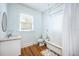 Charming bathroom features classic fixtures, including a clawfoot tub with pebble accents, and a marble sink at 520 E Anderson St, Orlando, FL 32801