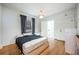 Cozy bedroom with hardwood floors, natural light, and open door to attached room at 520 E Anderson St, Orlando, FL 32801