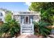 Charming home featuring a private rooftop deck, red front door and beautiful tropical landscaping at 520 E Anderson St, Orlando, FL 32801