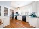 Spacious kitchen featuring white cabinetry, hardwood floors and modern appliances at 520 E Anderson St, Orlando, FL 32801
