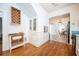 Bright eat-in kitchen with white cabinets, hardwood floors, and modern lighting at 520 E Anderson St, Orlando, FL 32801