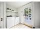 Clean laundry room with modern appliances and access to the outdoor space at 520 E Anderson St, Orlando, FL 32801