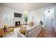 Bright living room featuring a cozy fireplace, hardwood floors and neutral decor at 520 E Anderson St, Orlando, FL 32801