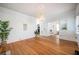 Bright living room with hardwood floors and neutral walls, complemented by a unique light fixture at 520 E Anderson St, Orlando, FL 32801