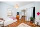 Inviting main bedroom featuring hardwood floors, large windows, and modern furnishings at 520 E Anderson St, Orlando, FL 32801