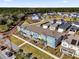Aerial view of townhouses with landscaping at 6403 Cyrils Dr, St Cloud, FL 34771