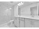 Modern bathroom featuring double sinks, a glass shower, and sleek finishes at 6403 Cyrils Dr, St Cloud, FL 34771