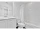 Small bathroom featuring tile flooring, white finishes, and a tub/shower combo at 6403 Cyrils Dr, St Cloud, FL 34771