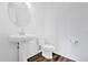 Powder room featuring hardwood floors, a large mirror and toilet at 6403 Cyrils Dr, St Cloud, FL 34771
