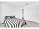 Neutral bedroom featuring comfortable carpeting and a doorway to another room at 6403 Cyrils Dr, St Cloud, FL 34771