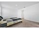 Empty bedroom featuring neutral carpeting and a doorway to another room at 6403 Cyrils Dr, St Cloud, FL 34771