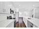 Kitchen features stainless steel appliances, white cabinets, and a large island for meal prep at 6403 Cyrils Dr, St Cloud, FL 34771