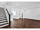 Open floor plan with hardwood floors, a modern kitchen, and staircase in view at 6403 Cyrils Dr, St Cloud, FL 34771
