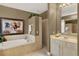 Bathroom featuring a vanity, bathtub, walk-in shower, and tile floors at 873 Gulf Land Dr, Apopka, FL 32712