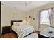 Cozy bedroom with natural light and a stylish accent rug and decor at 873 Gulf Land Dr, Apopka, FL 32712